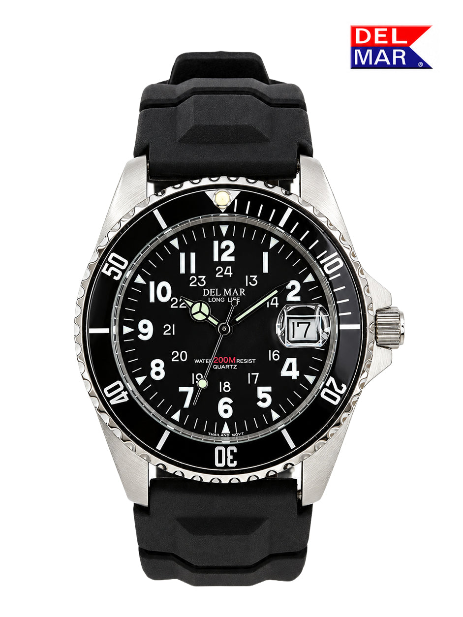 A Del Mar quartz wrist watch with a black rubber strap, silver stainless steel case, and a black dial with white Arabic numerals and a date window.
