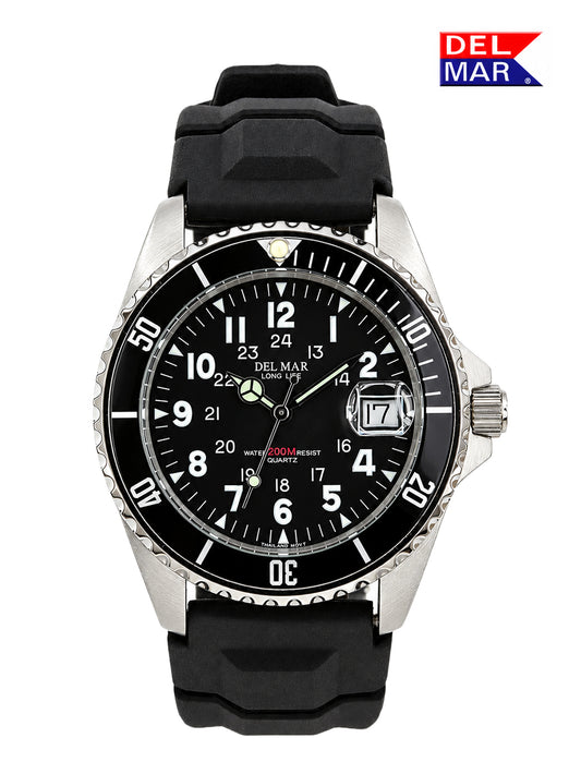 A Del Mar quartz wrist watch with a black rubber strap, silver stainless steel case, and a black dial with white Arabic numerals and a date window.
