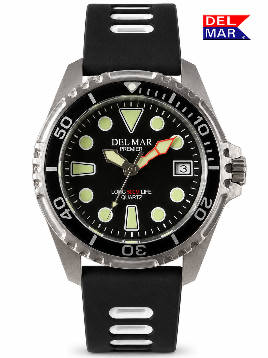 A Del Mar Premier Long Life Quartz watch with a black rubber strap, black dial, and silver stainless steel case, shown against a white background with a Del Mar logo in the top right corner.